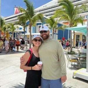Vacation couple enjoying a sunny day at an outdoor tropical location in Florida.